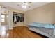 Bedroom with wood floors, ceiling fan, and closet at 2338 W Lindner Ave # 52, Mesa, AZ 85202