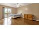 Bright bedroom with a sliding glass door and laminate wood flooring at 2338 W Lindner Ave # 52, Mesa, AZ 85202