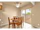 Eat-in kitchen area, with table, ceiling fan and sliding glass doors to the backyard at 2338 W Lindner Ave # 52, Mesa, AZ 85202
