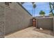 Side yard area of this home with small privacy fence and desert landscaping at 2338 W Lindner Ave # 52, Mesa, AZ 85202
