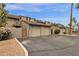 Exterior view of attached townhomes with garage parking at 2338 W Lindner Ave # 52, Mesa, AZ 85202