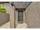 The front entrance to this home featuring a pergola for shade and a security door at 2338 W Lindner Ave # 52, Mesa, AZ 85202