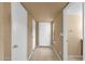 Entry way with neutral paint, ceramic tile floors, and coat closet for storage at 2338 W Lindner Ave # 52, Mesa, AZ 85202