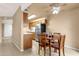 Cozy kitchen with stainless steel appliances and a warm wooden dining table set at 2338 W Lindner Ave # 52, Mesa, AZ 85202