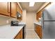 Efficient kitchen space with modern appliances and updated cabinets at 2338 W Lindner Ave # 52, Mesa, AZ 85202