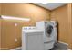 Laundry room with a washing machine, dryer, and water heater at 2338 W Lindner Ave # 52, Mesa, AZ 85202