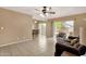 Open-concept living area with backyard access featuring a ceiling fan, ceramic tile flooring at 2338 W Lindner Ave # 52, Mesa, AZ 85202