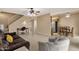 Open-concept living and dining area featuring a staircase, ceiling fan, and ceramic tile flooring at 2338 W Lindner Ave # 52, Mesa, AZ 85202