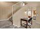 Carpeted staircase next to a desk and chair at 2338 W Lindner Ave # 52, Mesa, AZ 85202