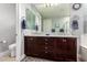 Bathroom with a double vanity, modern fixtures, and a large mirror for a bright, airy feel at 27007 N 20Th Ln, Phoenix, AZ 85085