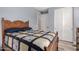 Bedroom with wood-look flooring, neutral color scheme, and access to a large closet space at 27007 N 20Th Ln, Phoenix, AZ 85085