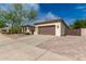 View of a single story home's exterior featuring manicured landscaping and a two car garage at 27007 N 20Th Ln, Phoenix, AZ 85085