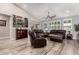 Spacious living room featuring stylish furniture, a ceiling fan, and recessed lighting at 27007 N 20Th Ln, Phoenix, AZ 85085