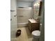 Bathroom featuring a shower-tub combo with sliding doors, vanity with storage, and a standard toilet at 2937 W Marshall Ave, Phoenix, AZ 85017