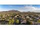Expansive aerial view of a neighborhood with mountain backdrop, showcasing community layout and scenic views at 2991 E Fandango Dr, Gilbert, AZ 85298