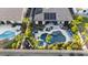 Expansive backyard with a pool, spa, outdoor kitchen, and lush landscaping captured from an aerial view at 2991 E Fandango Dr, Gilbert, AZ 85298
