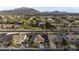 Wide aerial view of a desert community with mountain backdrop showing proximity to neighbors at 2991 E Fandango Dr, Gilbert, AZ 85298