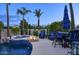 Serene backyard featuring a pool, hot tub, fire pit, and ample seating, perfect for outdoor gatherings at 2991 E Fandango Dr, Gilbert, AZ 85298