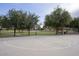 Outdoor basketball court surrounded by trees, providing a space for recreation and exercise at 2991 E Fandango Dr, Gilbert, AZ 85298