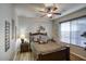 Cozy bedroom with warm tones, decorative wall art, and ample natural light, creating a peaceful retreat at 2991 E Fandango Dr, Gilbert, AZ 85298