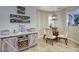 Cozy dining area with a modern light fixture and a sideboard with wine rack at 2991 E Fandango Dr, Gilbert, AZ 85298