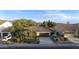 Beautiful single-Gathering home showing desert landscaping and a two car garage at 2991 E Fandango Dr, Gilbert, AZ 85298