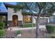 Inviting home exterior showcasing desert landscaping, a decorative front door, and a two-car garage at 2991 E Fandango Dr, Gilbert, AZ 85298