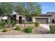 Charming home featuring desert landscaping, a two-car garage, and a decorative front door at 2991 E Fandango Dr, Gilbert, AZ 85298