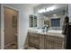 Main bathroom featuring double sinks, granite countertops, and modern fixtures at 2991 E Fandango Dr, Gilbert, AZ 85298