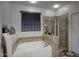 Luxurious main bathroom with a soaking tub and a glass-enclosed shower at 2991 E Fandango Dr, Gilbert, AZ 85298