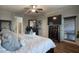 Comfortable main bedroom with hardwood floors, ceiling fan, and a view of the backyard at 2991 E Fandango Dr, Gilbert, AZ 85298
