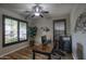 Comfortable home office with dark wood desk, ceiling fan and shuttered windows at 2991 E Fandango Dr, Gilbert, AZ 85298