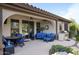 Covered patio with comfortable seating, a grill, and a ceiling fan, perfect for outdoor entertaining at 2991 E Fandango Dr, Gilbert, AZ 85298