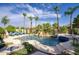 Resort-style pool featuring a rock waterfall, lush landscaping, and comfortable lounge chairs perfect for relaxation at 2991 E Fandango Dr, Gilbert, AZ 85298