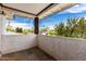 Balcony view showcasing desert scenery with tile floors, white plaster siding, and sturdy wood post at 3038 E Avalon Dr, Phoenix, AZ 85016