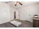 Bedroom featuring wood-look floors, a ceiling fan and an open doorway to an adjacent room at 3038 E Avalon Dr, Phoenix, AZ 85016