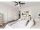 Bedroom featuring wood-look floors, a ceiling fan and a view into the en suite bathroom at 3038 E Avalon Dr, Phoenix, AZ 85016