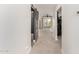 Upstairs hallway features a sliding barn door, neutral carpet, and natural light from the windows ahead at 3038 E Avalon Dr, Phoenix, AZ 85016