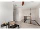 Second floor hallway featuring neutral carpet, stylish lighting, and a decorative wrought iron railing at 3038 E Avalon Dr, Phoenix, AZ 85016