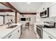 Bright kitchen featuring stainless appliances, quartz countertops, and a center island with sink at 3038 E Avalon Dr, Phoenix, AZ 85016