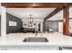 Bright kitchen boasts granite countertops, stainless steel appliances, and a sizable eat-in island at 3038 E Avalon Dr, Phoenix, AZ 85016