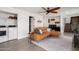Open floorplan features living room that opens to washer/dryer, stairs to the second floor and kitchen at 3038 E Avalon Dr, Phoenix, AZ 85016