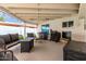 Covered patio with barbecue, mini fridge, mounted tv, and outdoor seating perfect for entertaining at 3038 E Avalon Dr, Phoenix, AZ 85016