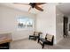 Cozy sitting area features modern black chairs, neutral carpet, and a window with bright natural light at 3038 E Avalon Dr, Phoenix, AZ 85016