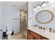 Stylish bathroom with tiled shower, modern vanity, and light fixtures at 31 W Marlette Ave, Phoenix, AZ 85013