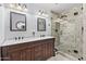 Bathroom featuring a double vanity, white marble countertops, and a walk-in shower at 31 W Marlette Ave, Phoenix, AZ 85013