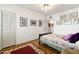 Bright bedroom with hardwood floors and a comfortable bed with patterned linens at 31 W Marlette Ave, Phoenix, AZ 85013