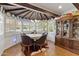 Cozy breakfast nook featuring a round table, leather chairs, unique ceiling design, and ample natural light at 31 W Marlette Ave, Phoenix, AZ 85013