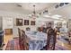 Elegant dining room with chandelier, art-lined walls, and views into the living room and gourmet kitchen at 31 W Marlette Ave, Phoenix, AZ 85013
