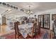 Open dining room with a formal table, french doors, hardwood floors, and a gorgeous chandelier at 31 W Marlette Ave, Phoenix, AZ 85013